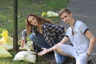 Black on the Right with his gf pointing out a a beautiful bag(colorized)